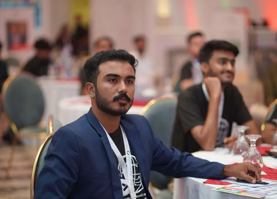Arshad Ali working at his desk
